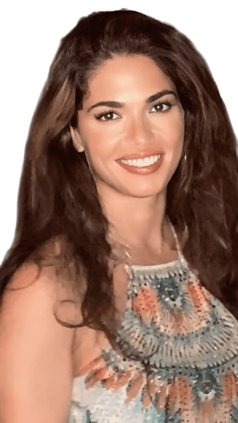 Smiling woman with long brown hair in a floral dress.